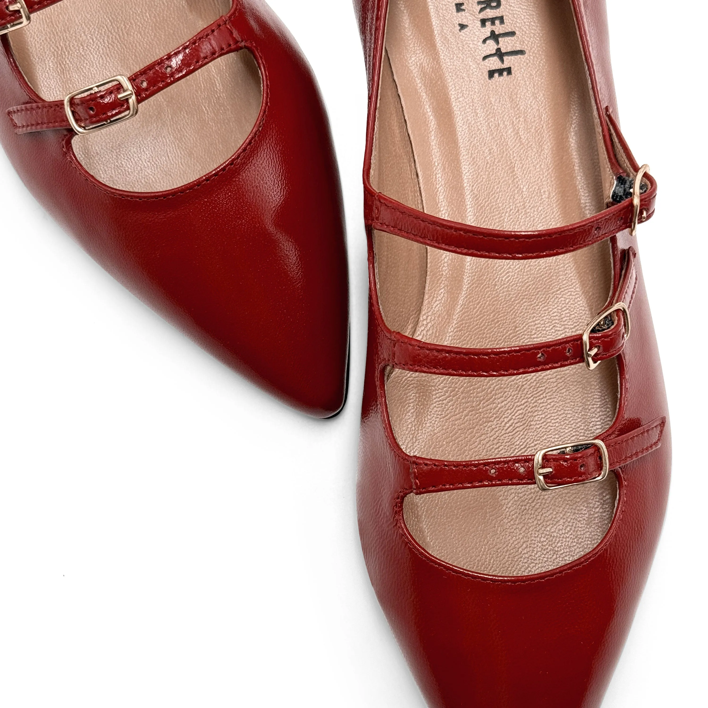 Red shiny pointed-toe ballet flats with straps